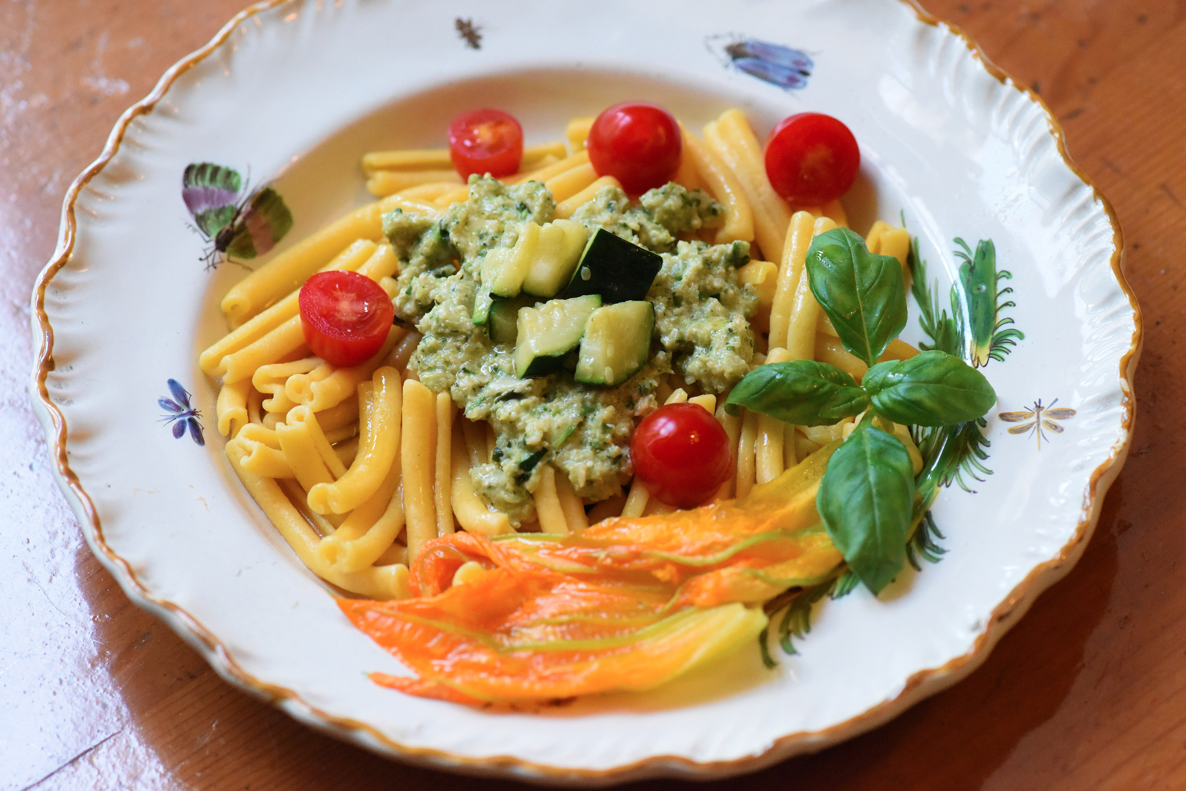 Pasta Rustica with a courgette 'pesto' sauce, cherry tomatoes and pumpkin flowers