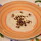 Biancoperla corn-based cream with a fondue of cheese, truffle and nuts